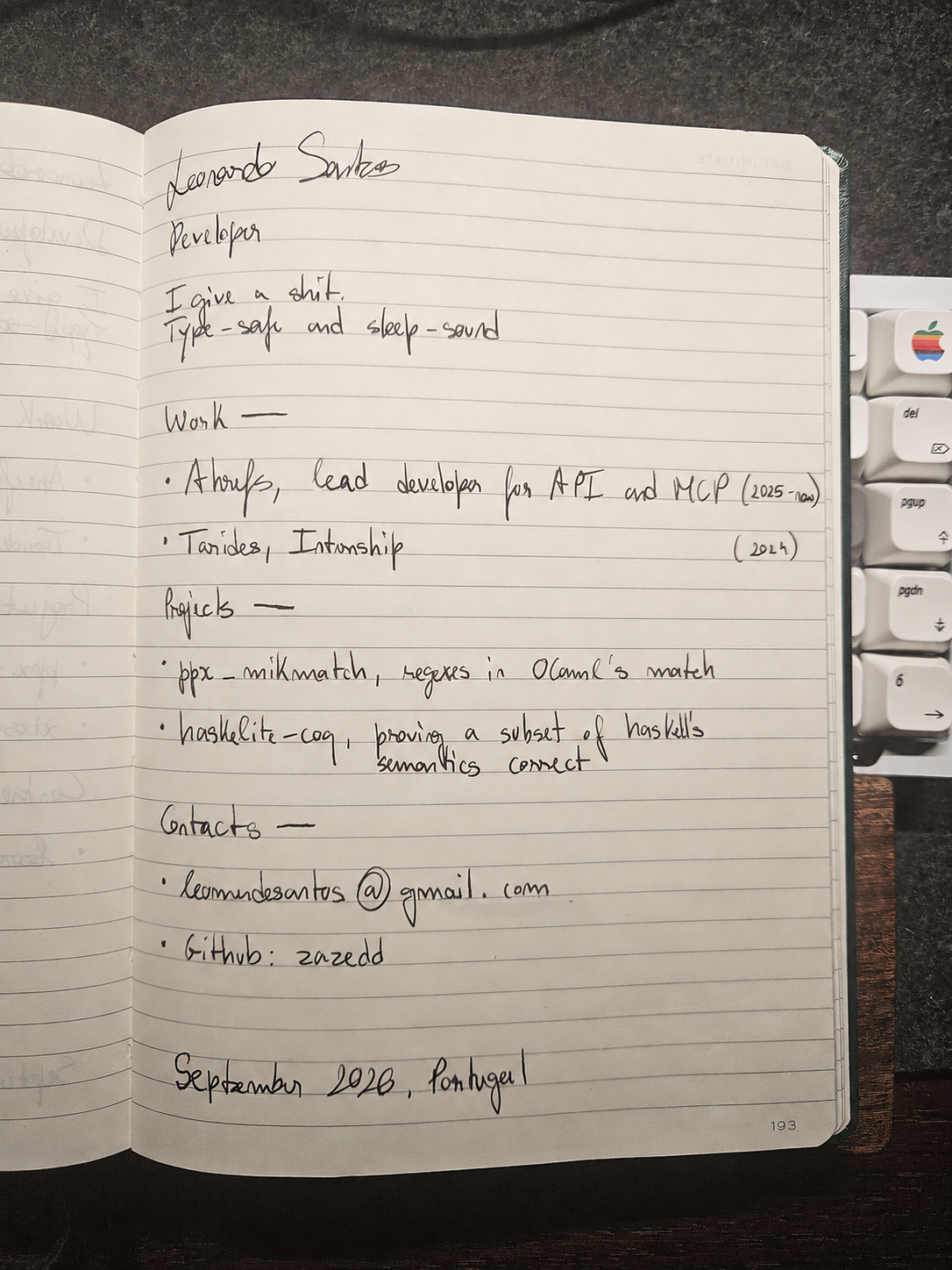 An open notebook displaying Leonardo Santos's handwritten portfolio.
